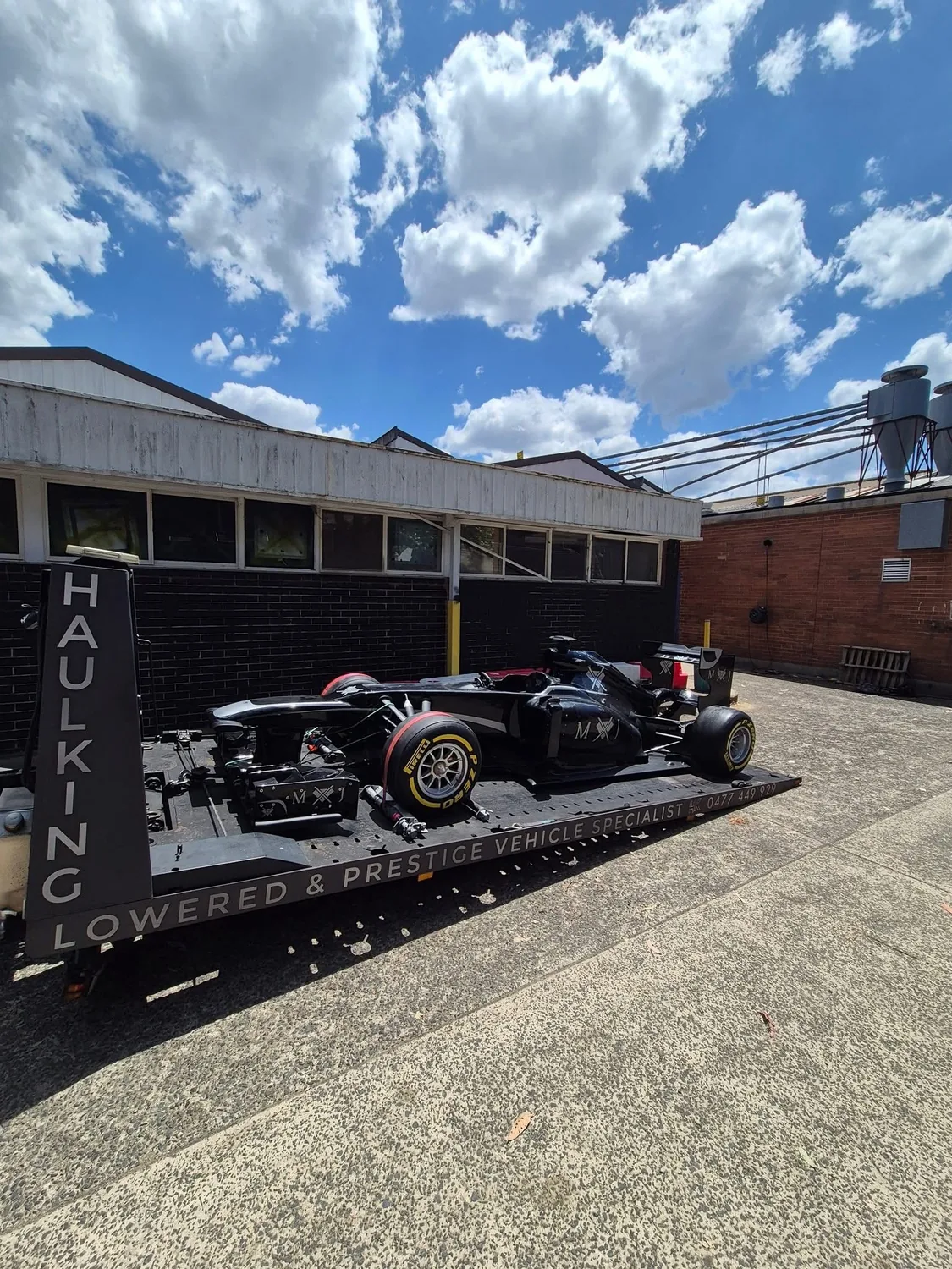 Single-seater race car loaded on Haul King's tray in Sydney