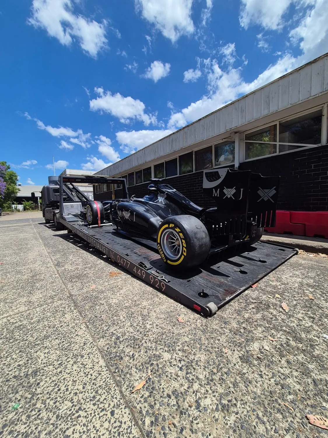 Single-seater race car loaded on Haul King's tray in Sydney