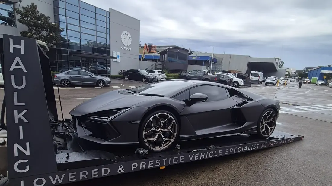 Lamborghini beside Haul King's prestige vehicle signage