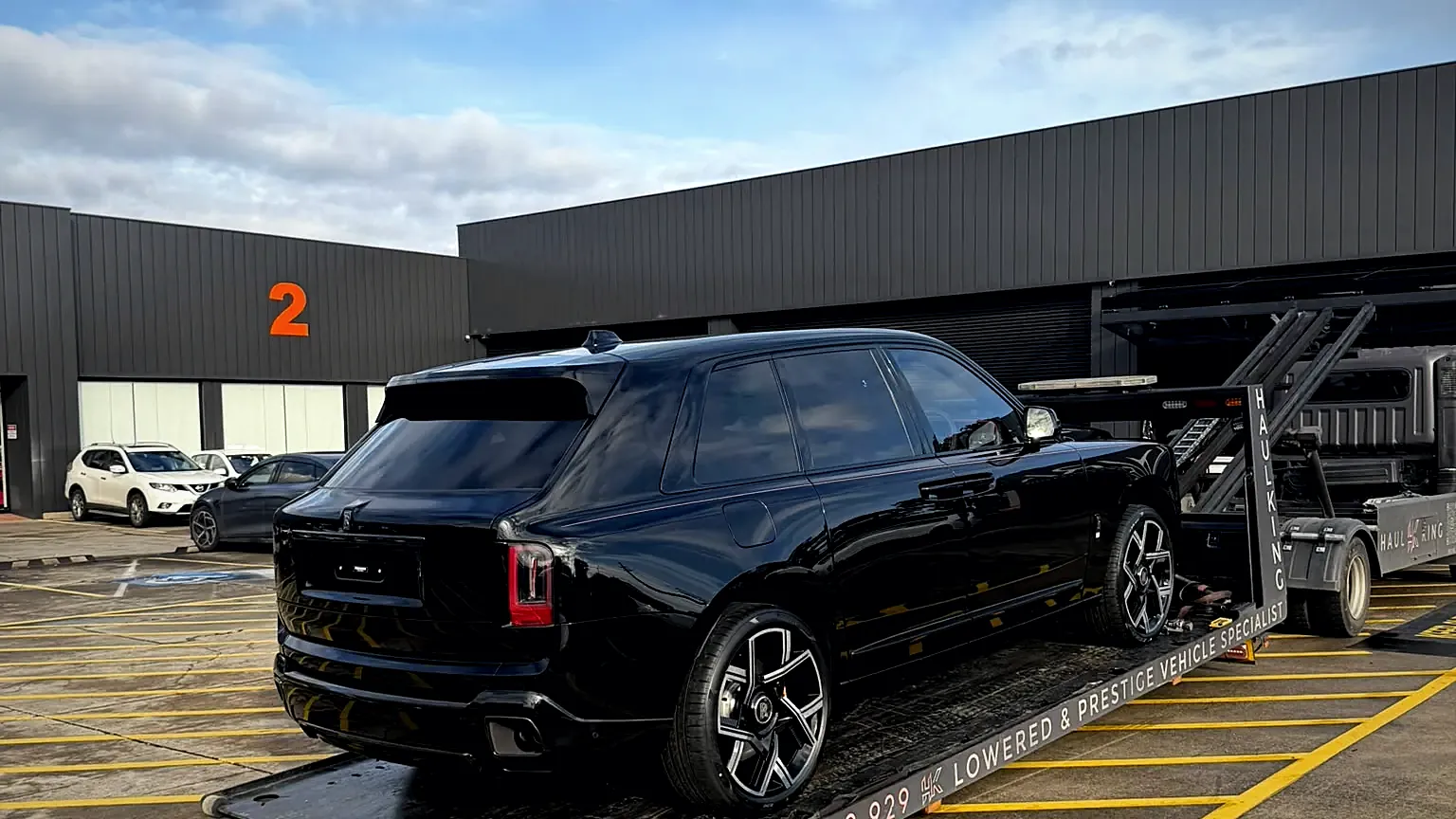 Black Rolls-Royce Cullinan Black Badge loaded on Haul King's low-angle tilt tray in Sydney
